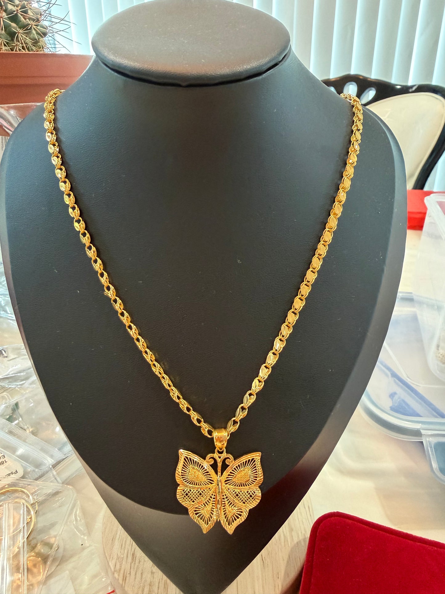 21k Damascus chain with butterfly pendant